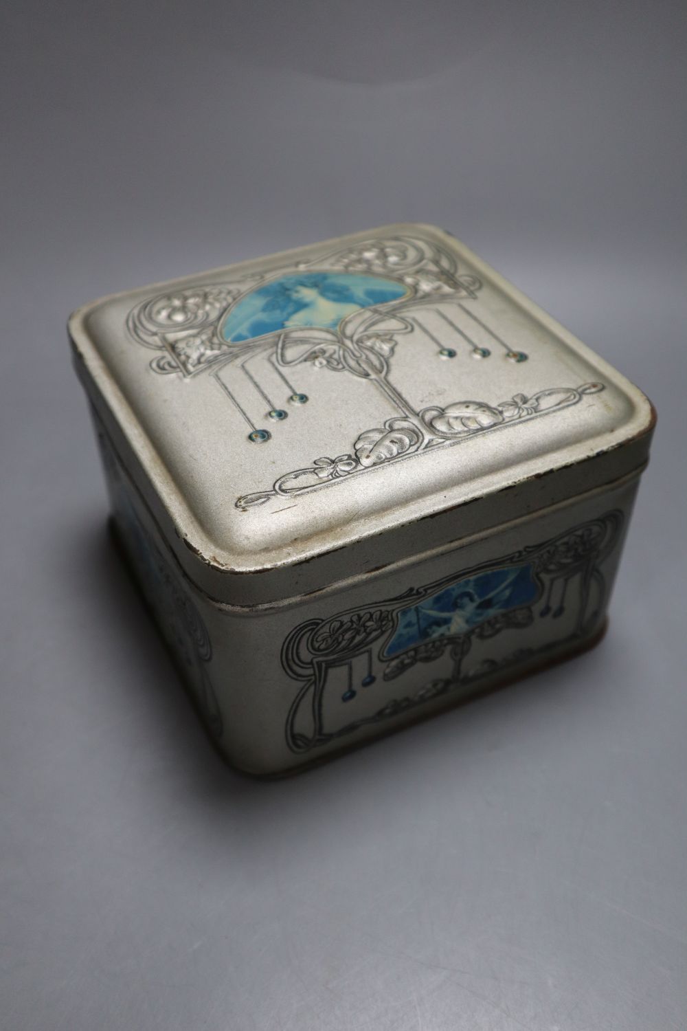 Two Jacobs biscuit tins, embossed coffer, 16cm wide and a Pomegranate design after Moorcroft and one other biscuit tin